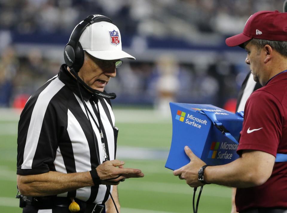 Referee Walt Anderson watches a replay.