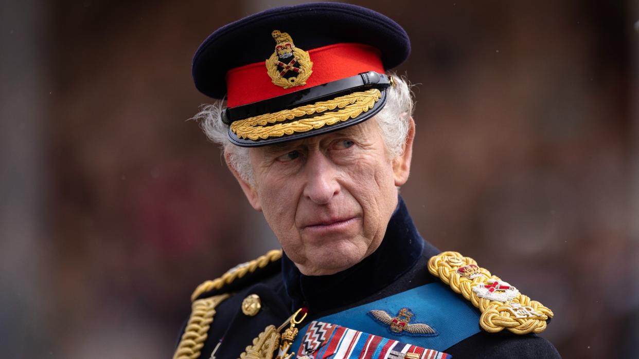  King Charles III inspects the 200th Sovereign's parade at Royal Military Academy Sandhurst on 14 April 2023 . 
