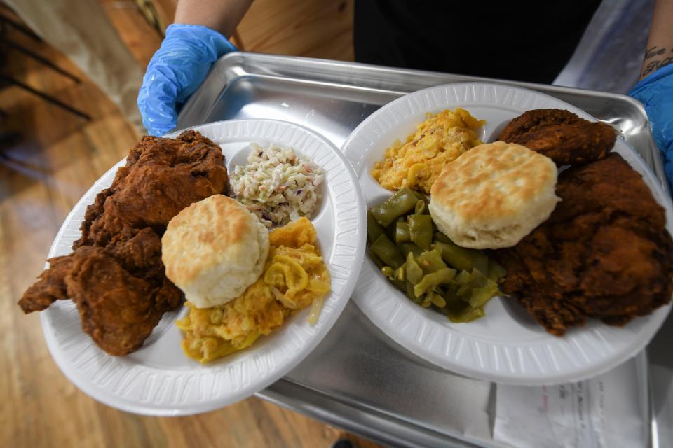 Plates of fried chicken leave the kitchen at Grandaddy's Kitchen in Appling, Ga., on Wednesday, Sept. 6, 2023.