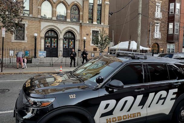 PHOTO: Hoboken Police officers stand watch outside the United Synagogue of Hoboken, Nov. 3, 2022, in Hoboken, N.J., after the FBI said is received information about credible threats. (Ryan Kryska/AP)