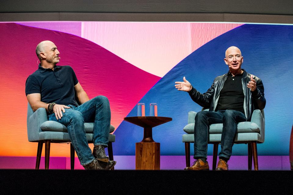 Mark Bezos, left, and Jeff Bezos will be passengers on a flight into space planned for July 20.