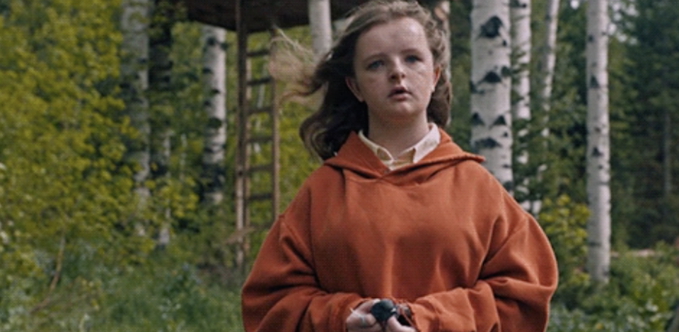 The daughter from "Hereditary" outside in the woods