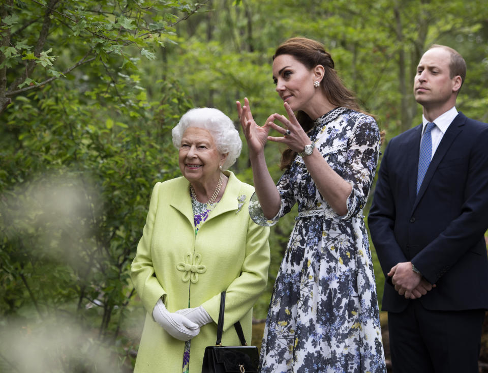 Kate shows the Queen around the 'Back to Nature' garden she co-designed at the Chelsea Flower Show [Photo: PA]