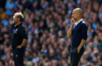 <p>Manchester City manager Pep Guardiola and Liverpool manager Juergen Klopp look on </p>