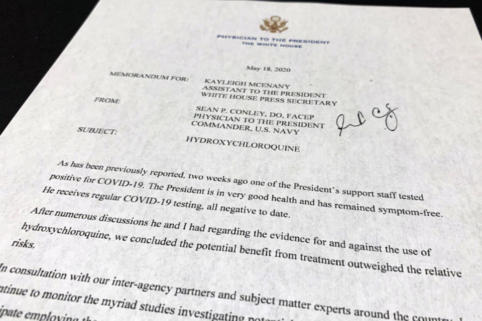 The letter from White House physician Sean Conley to White House press secretary Kayleigh McEnany about President Donald Trump taking Hydroxychloroquine is photographed Monday, May 18, 2020. Trump says he has taken the unproven malaria drug to prevent symptoms should he get coronavirus. (AP Photo/Jon Elswick)