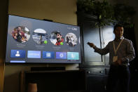 In this photo taken Tuesday, Sept. 17, 2019, product manager Bill Park demonstrates Facebook Portal TV during an event in San Francisco. Facebook is slashing the price and the size of the Portal, its screen and camera-equipped gadget for making video calls with friends and family as it attempts to get the device into more homes. A smaller version will now cost $129 and have an 8 inch display. A larger version will cost $179 and have a 10 inch display. (AP Photo/Eric Risberg)