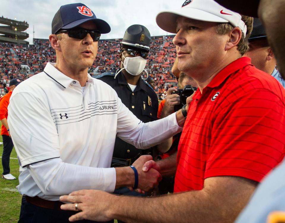 Auburn Tigers head coach Bryan Harsin and Georgia Bulldog head coach Kirby Smart shake hands after the game at Jordan-Hare Stadium in Auburn, Ala., on Saturday, Oct. 9, 2021. Georgia Bulldogs defeated the Auburn Tigers 34-10.