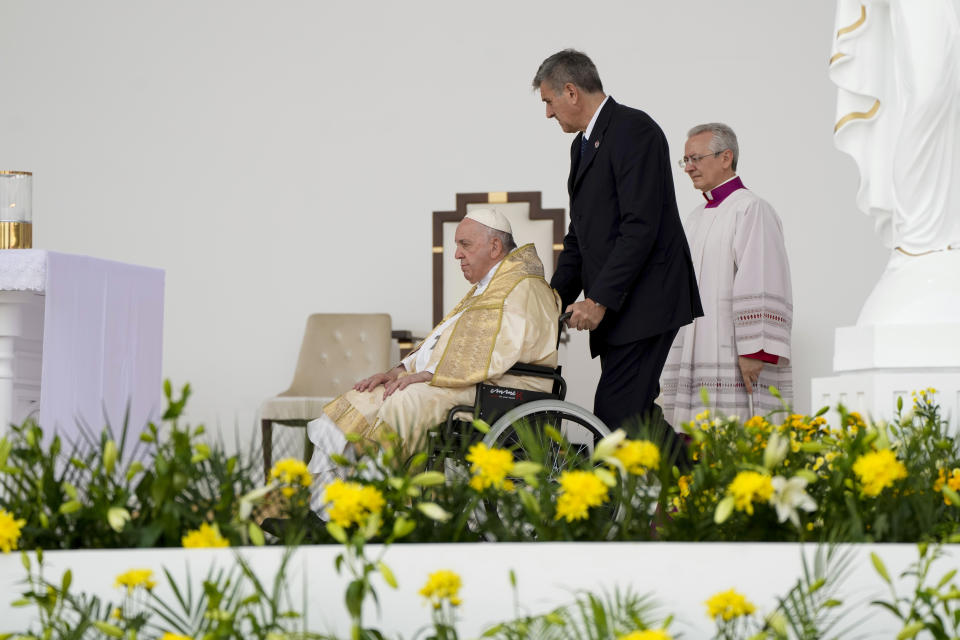 Pope Francis arrives to celebrate mass at the Bahrain National Stadium in Riffa, Bahrain, Saturday, Nov. 5, 2022. Pope Francis is making the November 3-6 visit to participate in a government-sponsored conference on East-West dialogue and to minister to Bahrain's tiny Catholic community, part of his effort to pursue dialogue with the Muslim world. (AP Photo/Alessandra Tarantino)