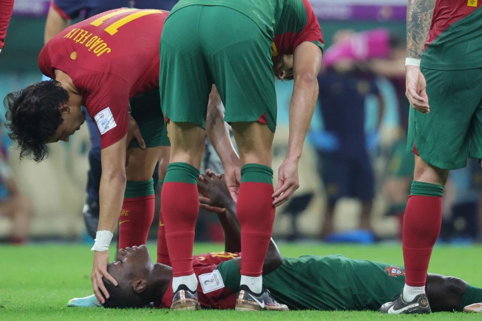 Nuno Mendes (bottom) was taken off injured after an encouraging display against Uruguay (EPA)