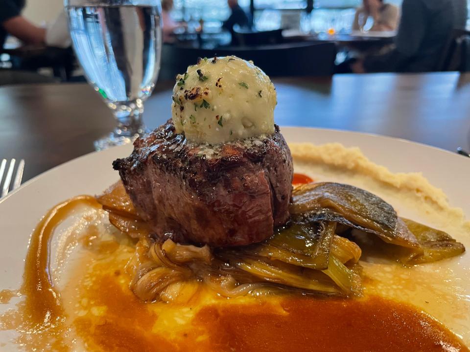 Fire & Salt is a fine dining restaurant in Oak Ridge that serves expertly prepared cuisine in a relaxed contemporary setting. The Fire & Salt filet is served with braised leeks, celeriac puree, hot sauce reduction and blue cheese compound butter.