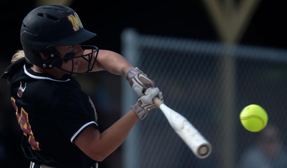 McCutcheon Mavericks Maggie Robbins (14) swings at the ball during the IHSAA softball game against the West Lafayette Red Devils, Friday, April 14, 2023, at West Lafayette High School in West Lafayette, Ind. McCutcheon won 9-1.