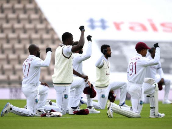The West Indies players wore black gloves on their right hands as they took a knee (PA)