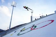 Jarl Magnus Riiber, of Norway, soars through the air during the competition round of the individual Gundersen large hill/10km ski jumping competition at the 2022 Winter Olympics, Tuesday, Feb. 15, 2022, in Zhangjiakou, China. (AP Photo/Andrew Medichini)