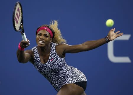 Serena Williams of the U.S. returns a shot to compatriot Taylor Townsend during their women's singles match at the U.S. Open tennis tournament in New York, August 26, 2014. REUTERS/Shannon Stapleton
