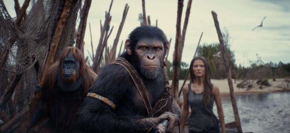 Noa (played by Owen Teague, center) goes on a quest with Raka (Peter Macon) and Mae (Freya Allan) to save his clan in the sci-fi adventure "Kingdom of the Planet of the Apes."