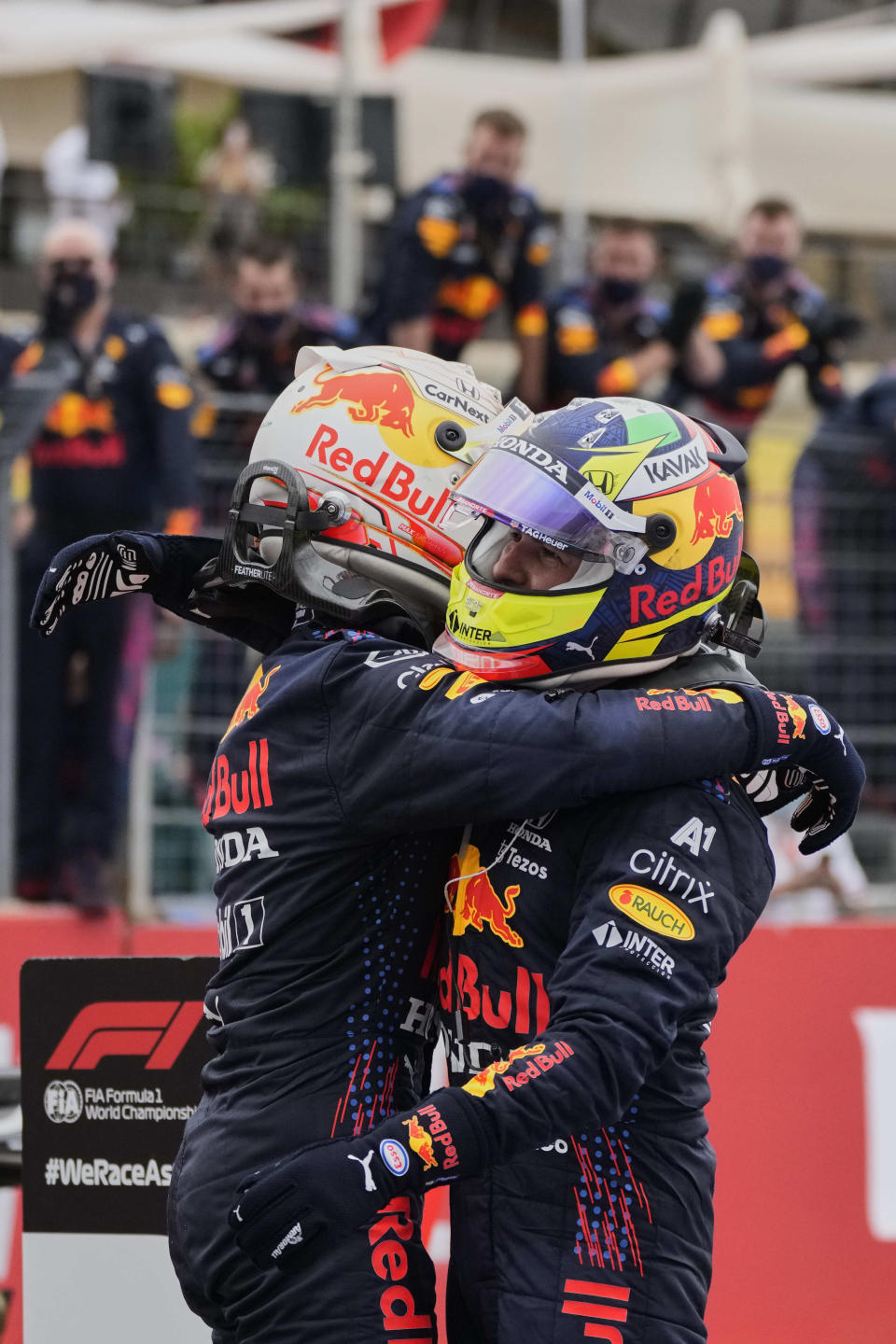 Red Bull driver Max Verstappen of the Netherlands, left, reacts after winning the French Formula One Grand Prix with third place Red Bull driver Sergio Perez of Mexico at the Paul Ricard racetrack in Le Castellet, southern France, Sunday, June 20, 2021. (AP Photo/Francois Mori)