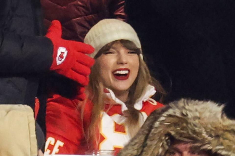 <p>Jamie Squire/Getty</p> Taylor Swift attends the AFC Wild Card Playoffs between the Miami Dolphins and the Kansas City Chiefs