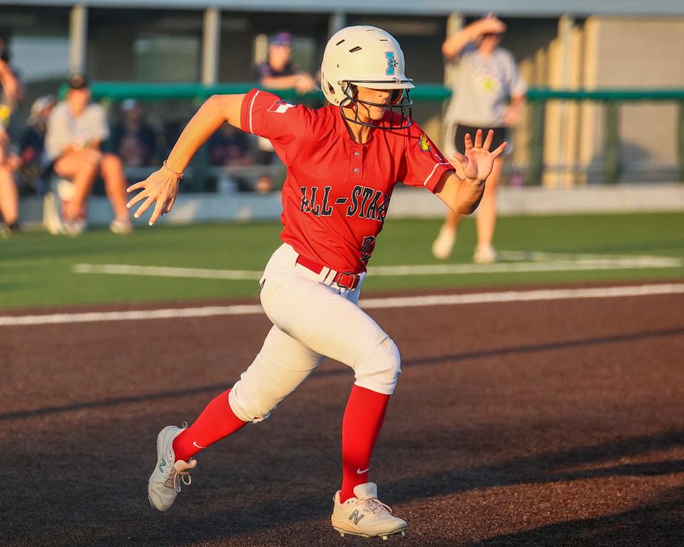 Round Rock's Bailee Morrison races to first base for the North squad in the 2022 Austin Area All-Star Softball Game on Wednesday at Dripping Springs High School. In the annual meeting between the top seniors from the past season, the South squad beat the North 11-3.