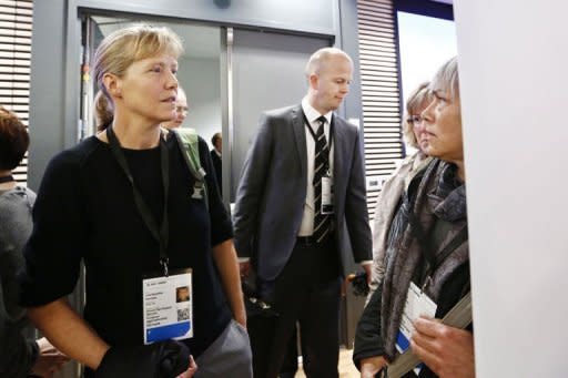 Line Benedikte Nersnaes (left), who suffered head injuries in the bomb attack in Oslo last July, arrives to give evidence in Oslo district court. Meanwhile tens of thousands of rose-waving Norwegians gathered in the city to deride mass murderer Anders Behring Breivik by singing a song he hates