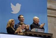 Actor Patrick Stewart (R) and 9-year-old Vivenne Harr (C), who uses proceeds from her lemonade stand to fight slavery, ring the opening bell as NYSE Executive Vice President and Head of Global Listings Scott Cutler and and Boston police officer Cheryl Fiandaca (L) look on during the Twitter Inc. IPO on the floor of the New York Stock Exchange in New York, November 7, 2013. REUTERS/Lucas Jackson