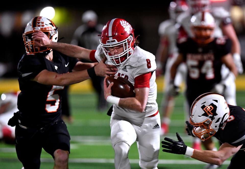 Pilot Point defensive back Wyatt Smith gets stiff-armed by Jim Ned quarterback Troy Doran during the Class 3A Div. 1 playoff game in Nov. 11 in Dublin. Jim Ned won 41-0.