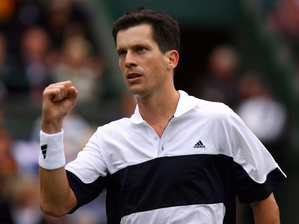 Tim Henman of Great Britain celebrates in his match against Roko Karanusic of Croatia during the official Davis Cup at the All England Lawn Tennis Club in Wimbledon.