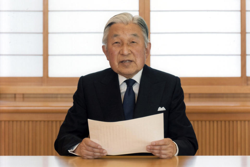 In this Aug. 7, 2016, file photo, provided by the Imperial Household Agency of Japan on Monday, Aug. 8, 2016, Japan's Emperor Akihito reads a message for recording at the Imperial Palace in Tokyo. Akihito expressed concern about fulfilling his duties as he ages in an address to the public in a 10-minute recorded speech broadcast on national television that was remarkable for its rarity and its hinted possibility that he may want to abdicate in a few years. Akihito’s Heisei era will end when he abdicates on April 30, 2019 in favor of his elder son, 58-year-old Crown Prince Naruhito, beginning a new, as yet unnamed era. (Imperial Household Agency of Japan via AP, File)