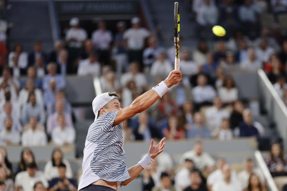 Denmark's Holger Rune smashes during the quarterfinal match of the French Open tennis tournament against Norway's Casper Ruud at the Roland Garros stadium in Paris, Wednesday, June 7, 2023. (AP Photo/Jean-Francois Badias)