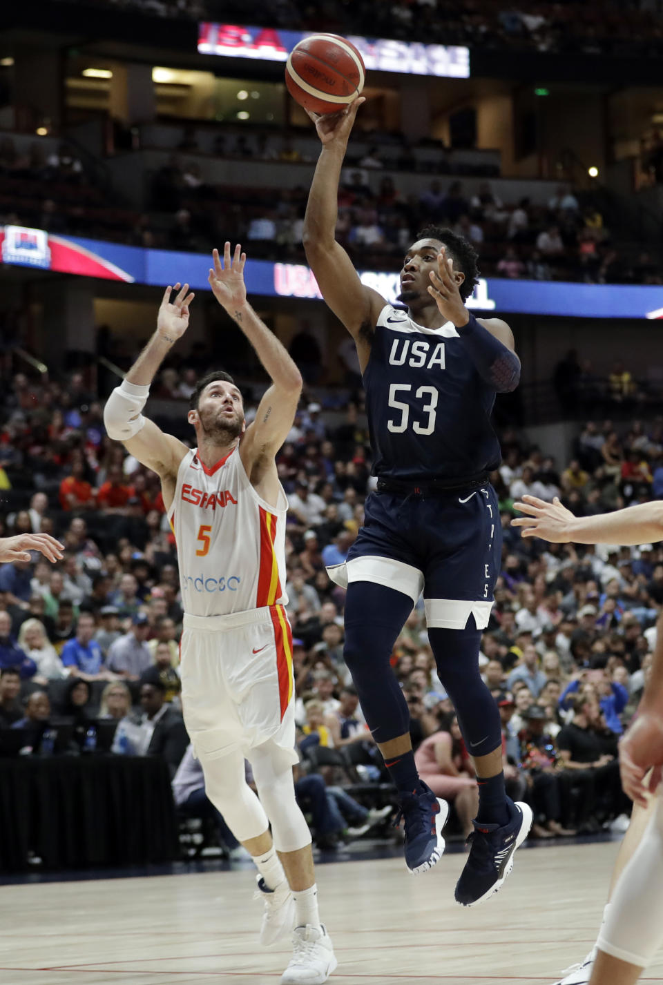 United States' Donovan Mitchell, right, shoots over Spain's Rudy Fernandez during the second half of an exhibition basketball game Friday, Aug. 16, 2019, in Anaheim, Calif. (AP Photo/Marcio Jose Sanchez)