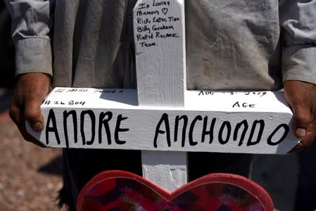 People pay their respects two days after a mass shooting in El Paso