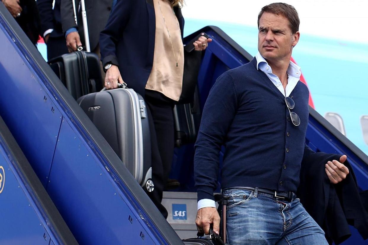 Frank de Boer (R) arrives with the Ajax team ahead of the UEFA Europa League Final between Ajax and Manchester United at Stockholm Arlanda Airport: Handout/UEFA via Getty Images