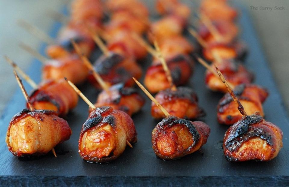 <p>The Gunny Sack</p><p>Little bites of chicken, bacon and spicy sriracha hit all the right taste buds at the same time.</p><p><strong>Get the recipe: <a href="https://www.thegunnysack.com/sweet-and-spicy-sriracha-bacon-chicken-bites#_a5y_p=2512613" rel="nofollow noopener" target="_blank" data-ylk="slk:Sweet and Spicy Sriracha Bacon Chicken Bites;elm:context_link;itc:0;sec:content-canvas" class="link ">Sweet and Spicy Sriracha Bacon Chicken Bites</a></strong></p>