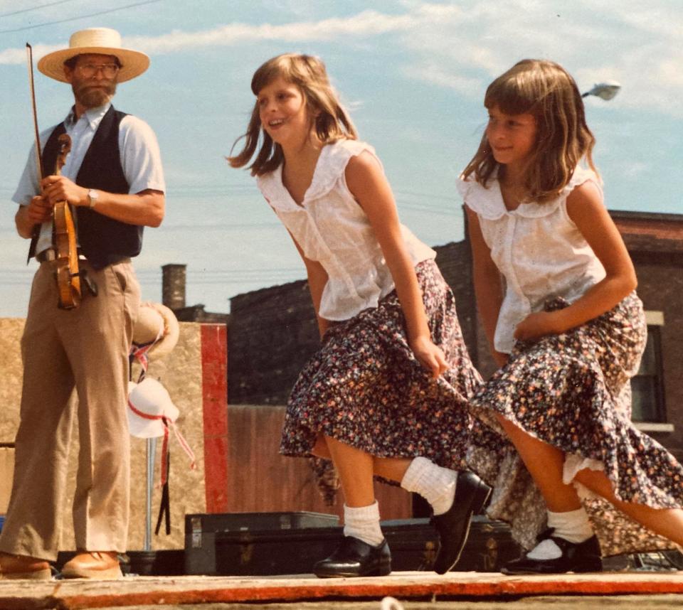 Paul Fotsch watches his daughters dance on stage in Michigan in the mid-1980s.