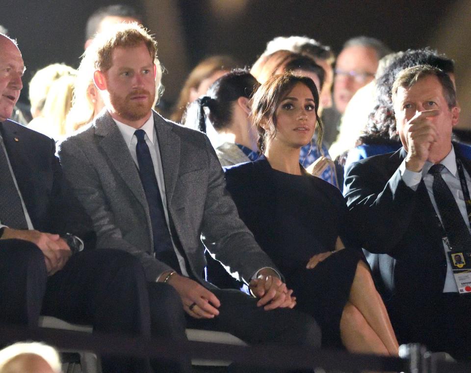 <p>The Duke and Duchess of Sussex hold hands.</p>