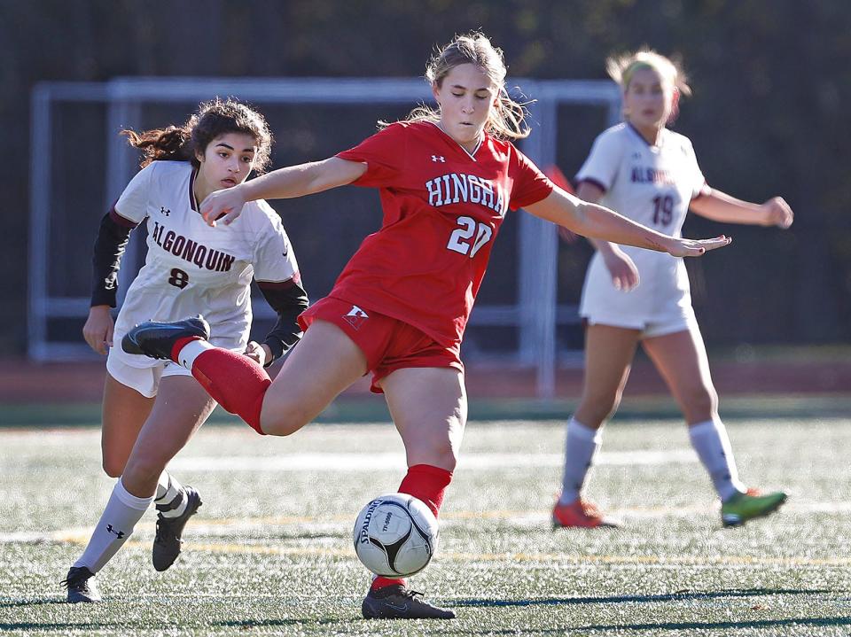 Hingham's Ava Varholak sends the ball upfield ahead of Ava Wile of Algonquin. Hingham girls soccer captured the Div. 1 state championship with a 1-0 victory over Algonquin in Walpole on Saturday, November 19, 2022.