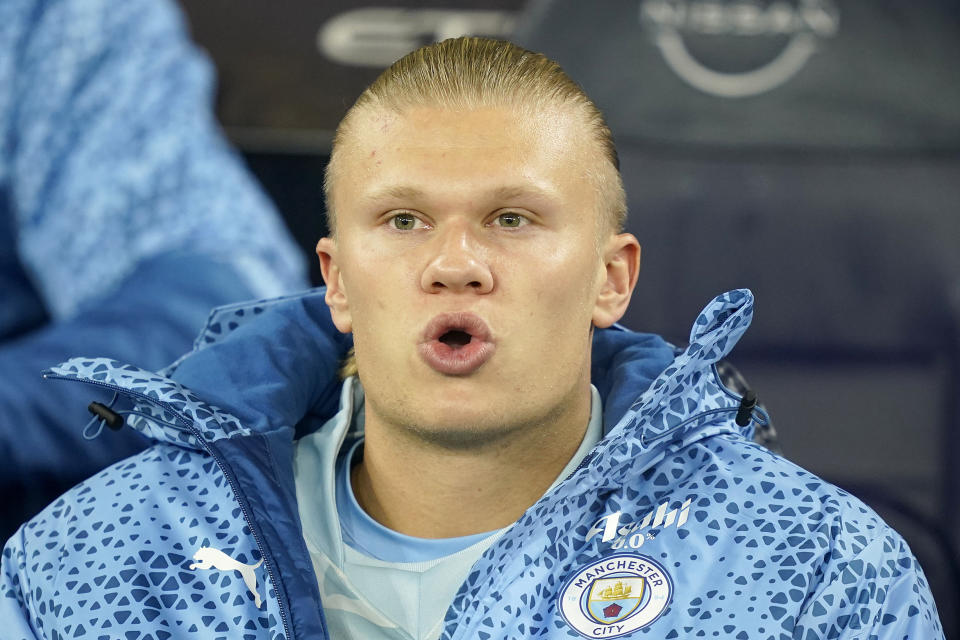 Manchester City's Erling Haaland sits on the bench during the English Premier League soccer match between Manchester City and Burnley at the Etihad Stadium in Manchester, Wednesday, Jan. 31, 2024.(AP Photo/Dave Thompson)