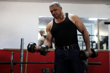 Ibrahim al-Masri, trains at a gym, on his last day as the chief muezzin of the Al-Jazzar Mosque, in Acre, northern Israel January 31, 2019. REUTERS/Ammar Awad