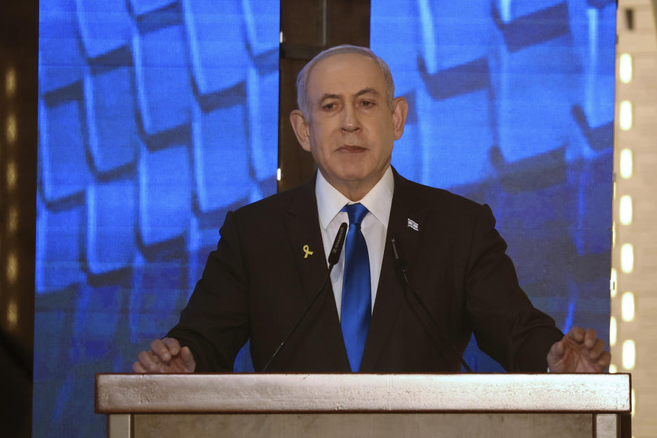 FILE - Israeli Prime Minister Benjamin Netanyahu addresses a ceremony marking Memorial Day for fallen soldiers of Israel's wars and victims of attacks at Jerusalem's Mount Herzl military cemetery Monday, May 13, 2024. On Friday, May 24, The Associated Press reported on stories circulating online incorrectly claiming the International Criminal Court issued an arrest warrant for Netanyahu. (Gil Cohen-Magen/Pool Photo via AP)