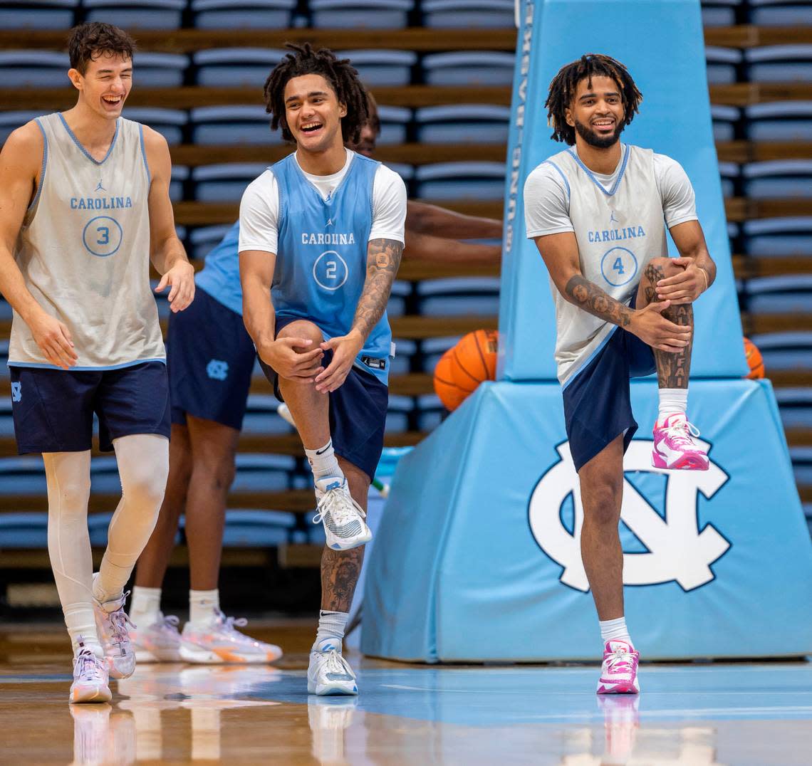 North Carolina’s Cormac Ryan (3) Elliott Cadeau (2) and R.J. Davis (4) stretch during the Tar Heels’ practice on Friday, October 6, 2023 at the Dean Smith Center in Chapel Hill, N.C.