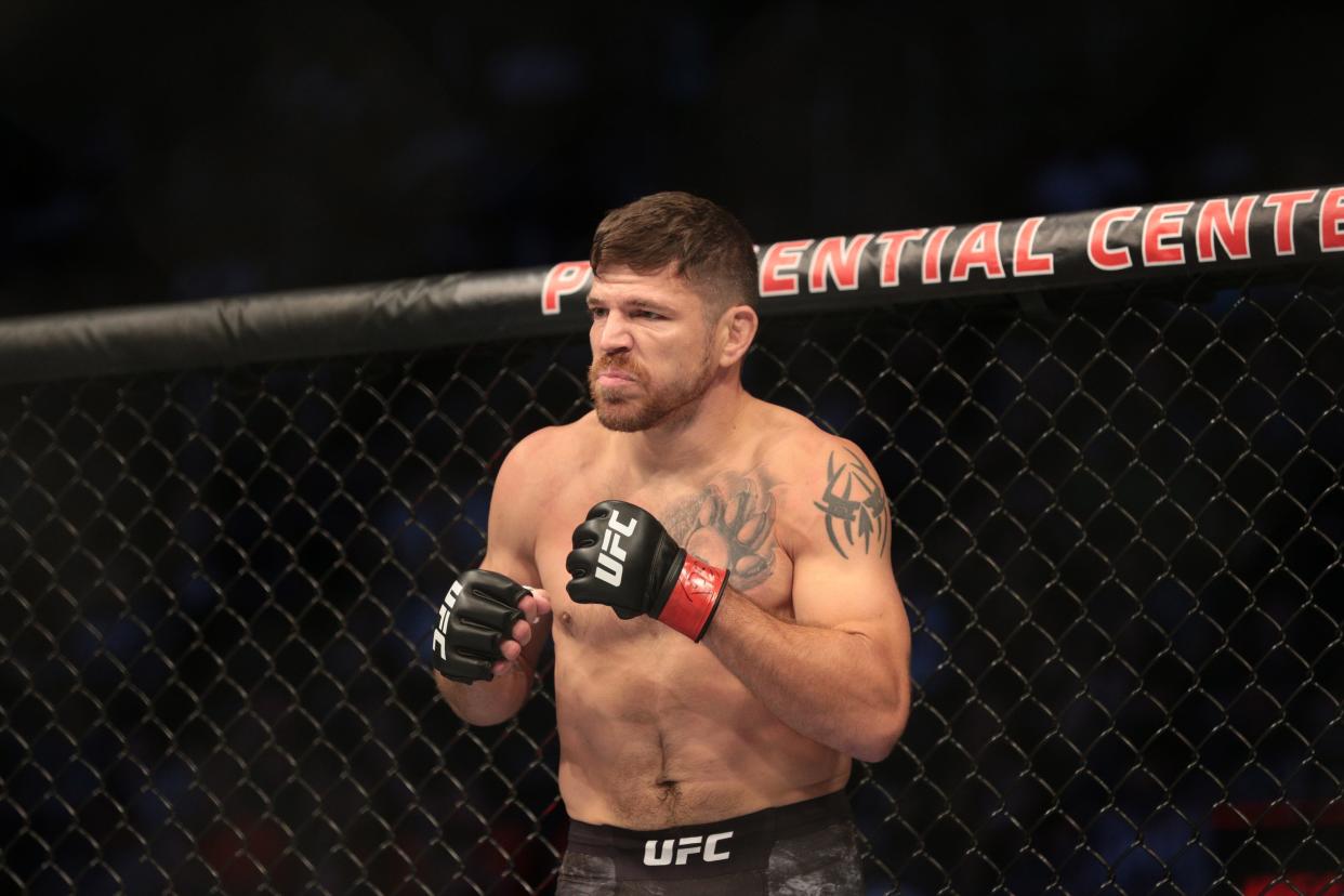 Aug 3, 2019; Newark, NJ, USA; Jim Miller (red gloves) fights Clay Guida (blue gloves) during UFC Fight Night at Prudential Center. Mandatory Credit: Vincent Carchietta-USA TODAY Sports