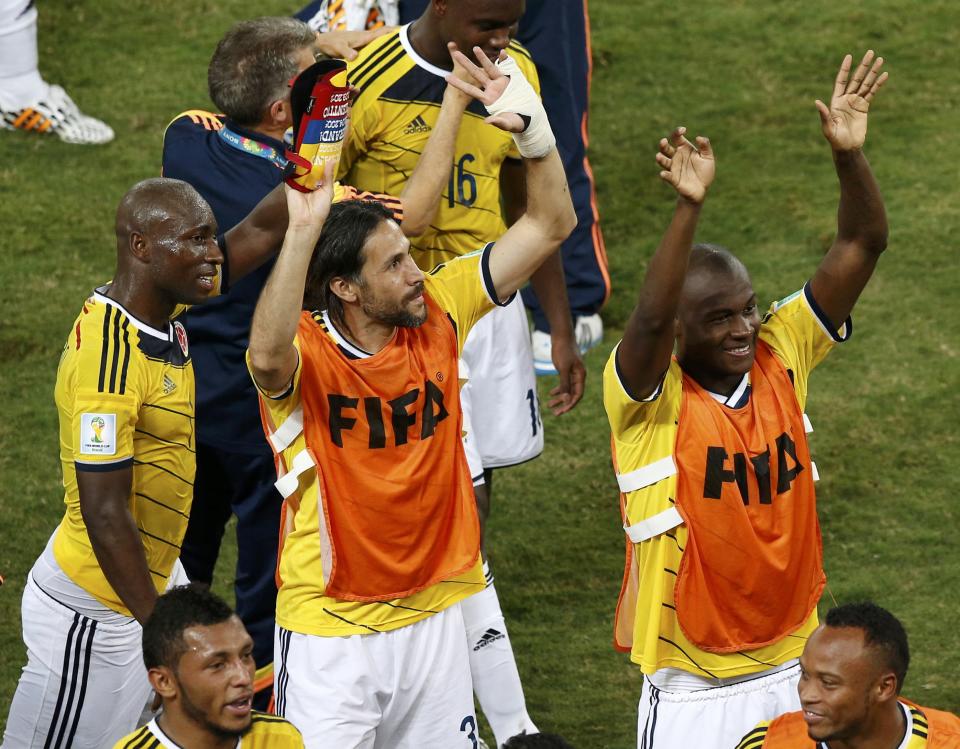 Colombia's players celebrate after their win against Japan after their 2014 World Cup Group C soccer match at the Pantanal arena in Cuiaba June 24, 2014. REUTERS/Suhaib Salem (BRAZIL - Tags: SOCCER SPORT WORLD CUP)