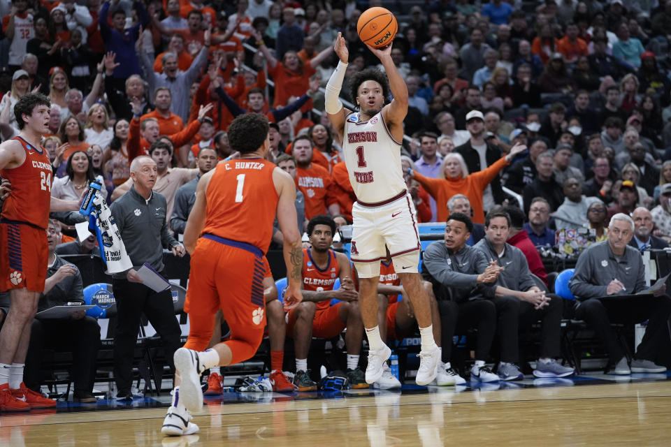 Alabama guard Mark Sears, right, shoots over Clemson guard Chase Hunter (1) during the first half of an Elite 8 college basketball game in the NCAA tournament Saturday, March 30, 2024, in Los Angeles. (AP Photo/Ashley Landis)