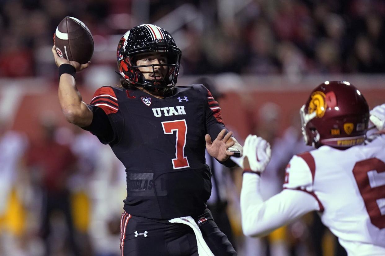 Cameron Rising throws a pass for Utah.