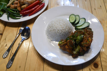 A plate of chicken rendang is pictured at a restaurant in Cyberjaya, Selangor, Malaysia April 4, 2018. REUTERS/Stringer