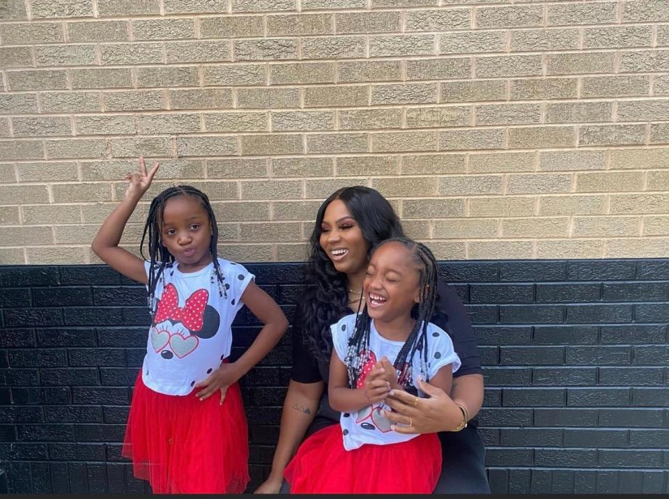 Milwaukee resident Shakayla Curtis, known as Kayla Danielle on social media, with her twin daughters Kaiden and Paiden. They've become TikTok stars for the cooking videos they make with their family.