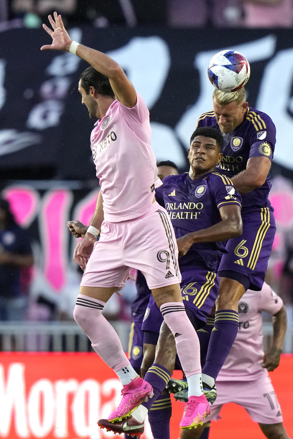 Orlando City midfielder Wilder Cartagena, center, and defender Robin Jansson (6) go for the ball as Inter Miami forward Leonardo Campana (9) defends during the first half of an MLS soccer match, Saturday, May 20, 2023, in Fort Lauderdale, Fla. (AP Photo/Lynne Sladky)