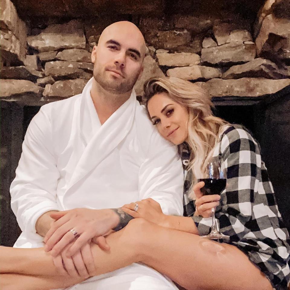 <p>During an October 2019 episode of their podcast <a href="http://ihr.fm/WhineDown" rel="nofollow noopener" target="_blank" data-ylk="slk:Whine Down with Jana Kramer and Mike Caussin;elm:context_link;itc:0;sec:content-canvas" class="link "><i>Whine Down with Jana Kramer and Mike Caussin</i></a>, the pair opened up about an incident involving the singer going through Caussin’s Apple Watch and finding a topless woman's photo that he had deleted from his phone without informing his wife.</p> <p>"I see it and I know the right thing to do is to go get Jana, pull her aside and say, 'Hey. I just received this. I don't know what the hell it is but I just need you to know.' I was terrified to do so," Caussin recalled.</p> <p>"Jana and I have had a really good run recently, like not a lot of past stuff coming up, we've been handling situations pretty well, handling triggers pretty well, talking things out," he added. "It really felt like we were really building a lot of forward momentum." </p> <p>However, not telling his wife backfired.</p> <p>"When I looked, I was like, 'Goddamnit.' I saw it and my heart just fell. It's here. It's happened again," Kramer said. "I'm such an f—ing idiot, and I immediately called my best friend and I was just shaking crying outside."</p> <p>In the end, Caussin apologized to his wife on-air. "I am sorry honey that I didn’t handle it the way that we agreed upon. I didn't handle it the right way for myself, for you, for both of us," he said.</p>