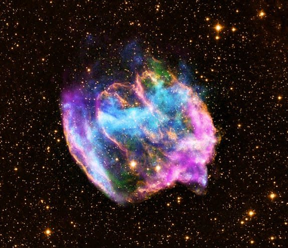The highly distorted supernova remnant W49B in this image may contain the youngest black hole in the Milky Way galaxy. The image combines X-rays from NASA's Chandra X-ray Observatory in blue and green, radio data from the NSF's Very Large Array