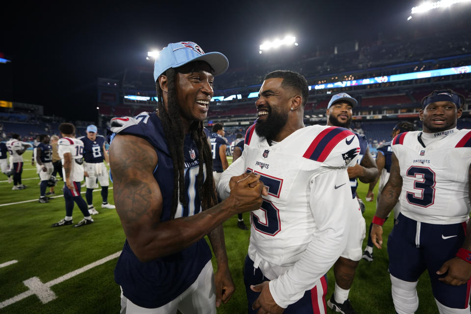 Tennessee Titans wide receiver DeAndre Hopkins, left, and New England Patriots running back Ezekiel Elliott (15) greet each other after an NFL preseason football game Friday, Aug. 25, 2023, in Nashville, Tenn. The Titans won 23-7. (AP Photo/John Amis)