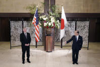 U.S. Special Representative for North Korea Stephen Biegun, left, and Japanese Vice Foreign Minister Takeo Akiba, right, pose for a photo session prior to their bilateral meeting at Iikura Guest House Thursday, July 9, 2020, in Tokyo. (AP Photo/Eugene Hoshiko, Pool)